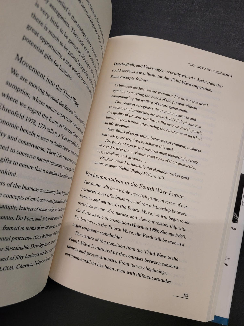 An open book showing printed text on two pages, photographed against a dark background.