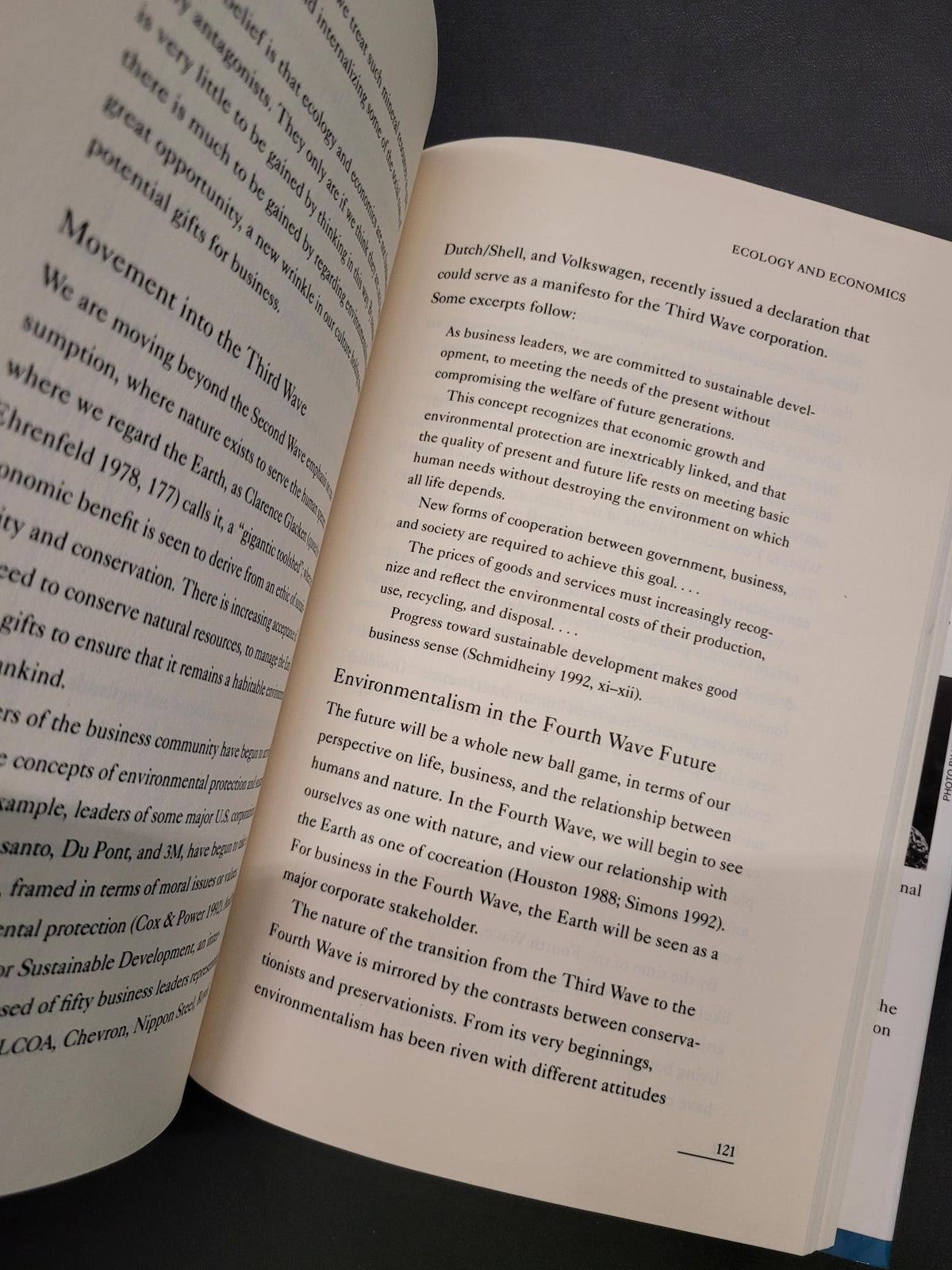 An open book showing printed text on two pages, photographed against a dark background.