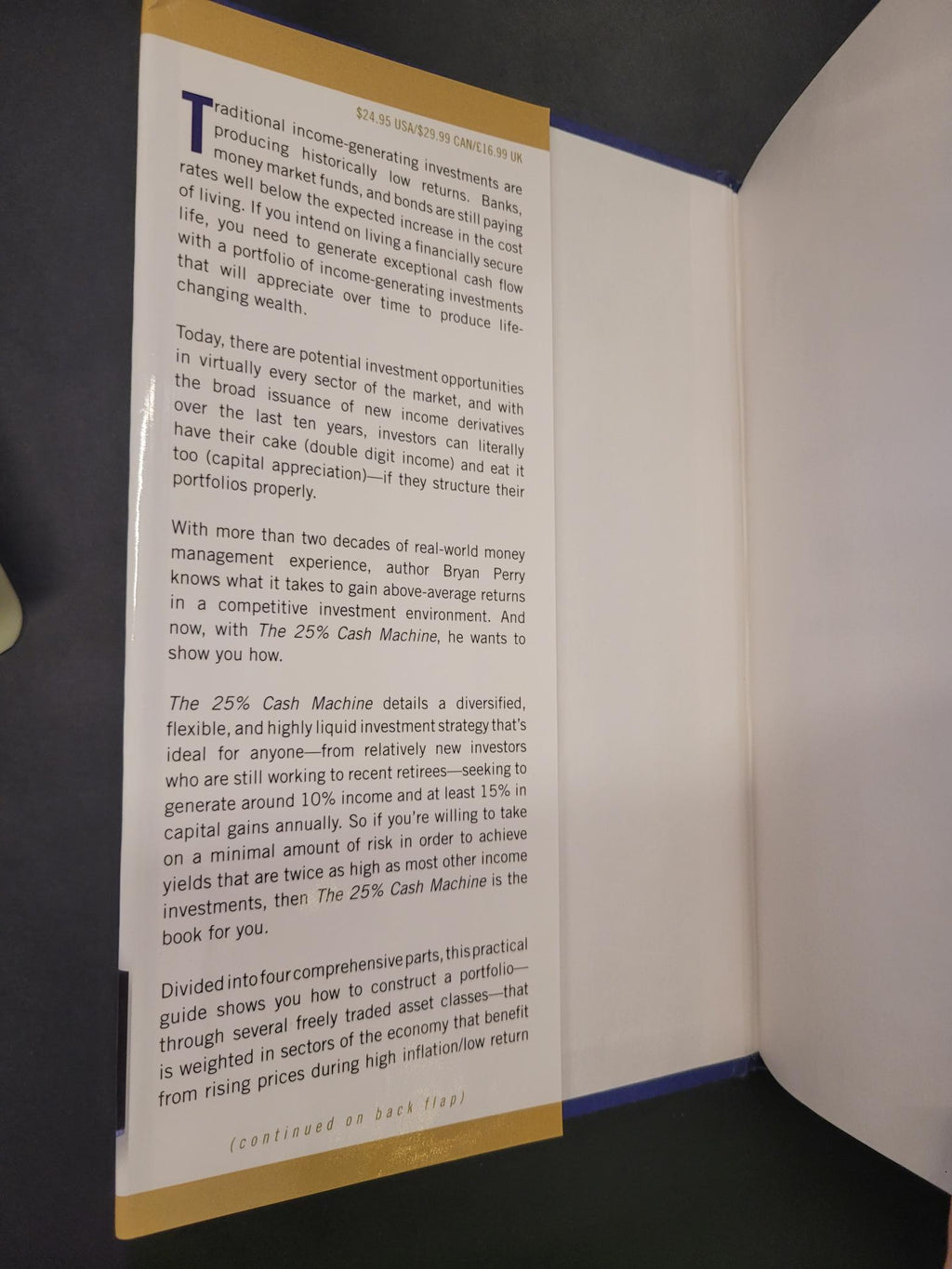 An open book or booklet showing a printed page with text, photographed from above on a dark surface.