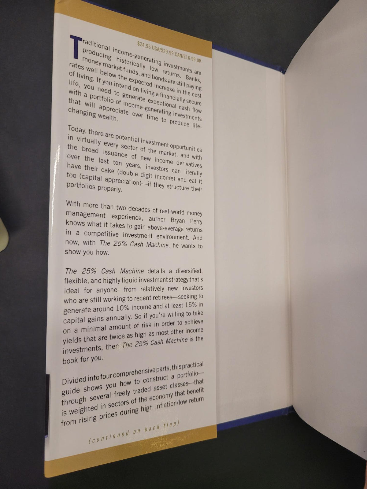 An open book or booklet showing a printed page with text, photographed from above on a dark surface.
