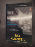 The front cover of the book 'The Singularity Is Near' by Ray Kurzweil, published by Penguin. The cover is predominantly black with a gray geometric pattern, white text, and yellow author name.