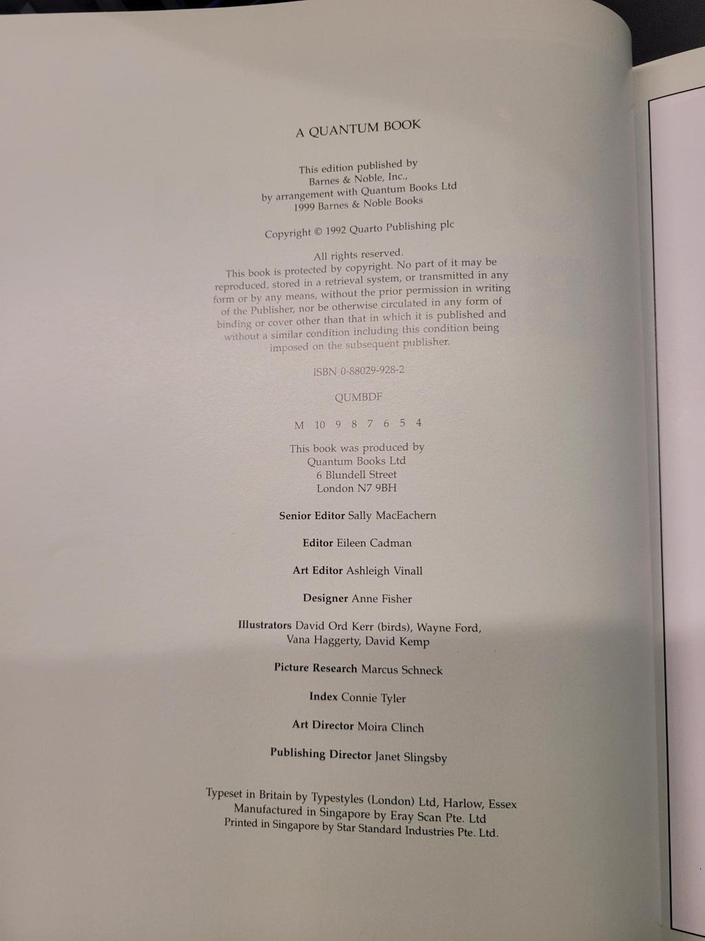 A close-up of an open book's printed interior page with black text on white paper, photographed from above at a slight angle.