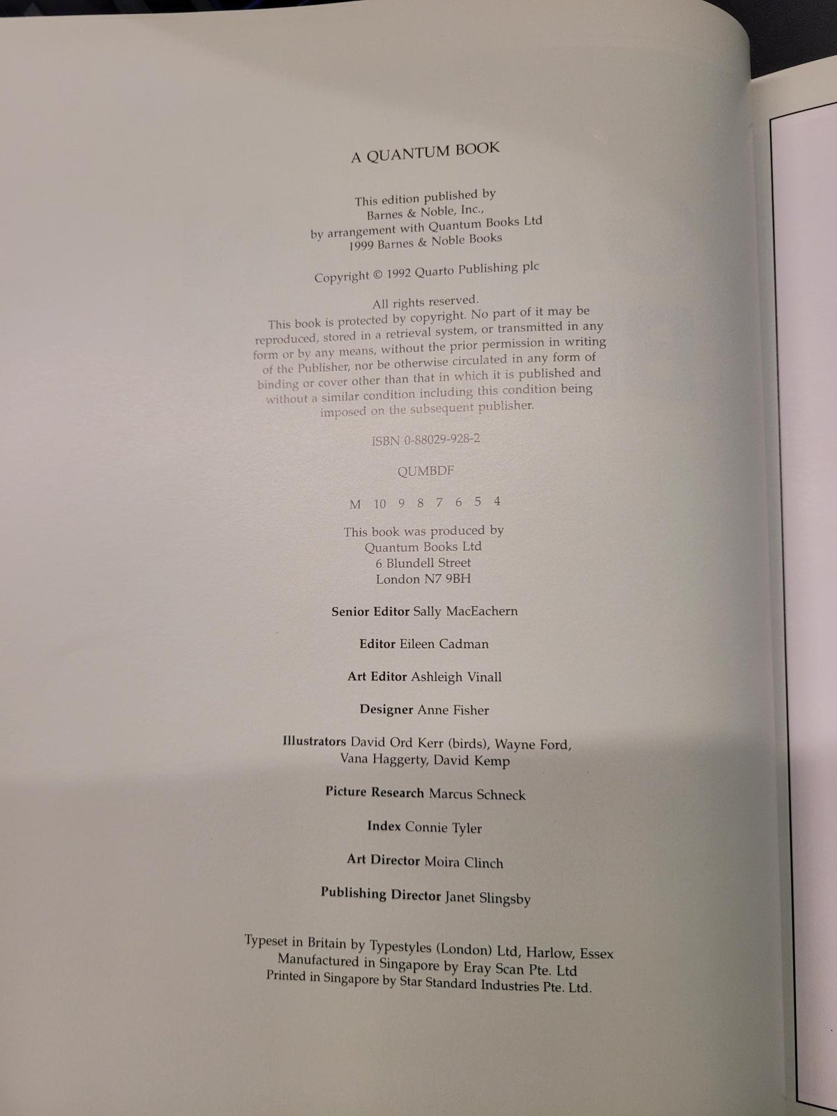 A close-up of an open book's printed interior page with black text on white paper, photographed from above at a slight angle.