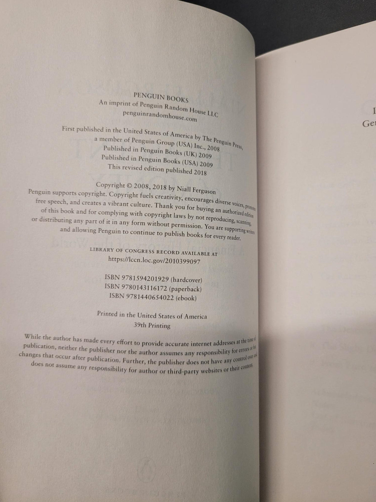 An open book showing printed text on the pages, photographed against a dark background.