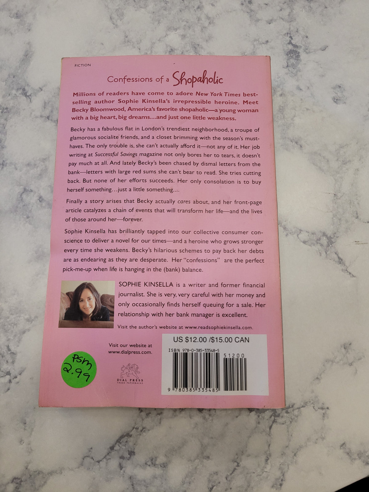 The back cover of the book 'Confessions of a Sexaholic' by Sophie Knaffle, displayed on a white and gray marble surface. The cover is light pink with black text, a barcode, and a small author photo.